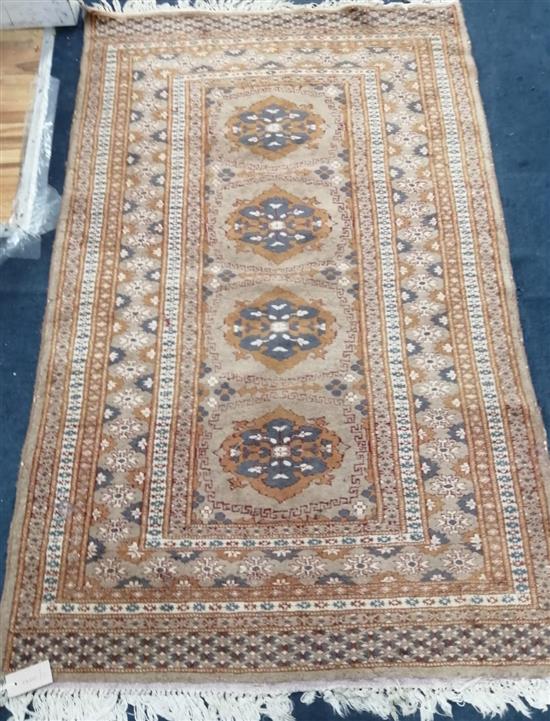 A Bokhara fawn ground rug 154 x 96cm